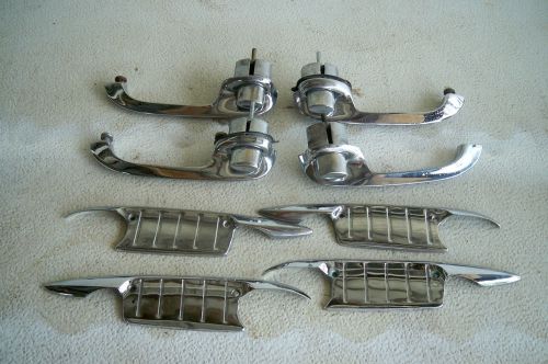 Four used 1957 chevy door handles &amp; scratch guards