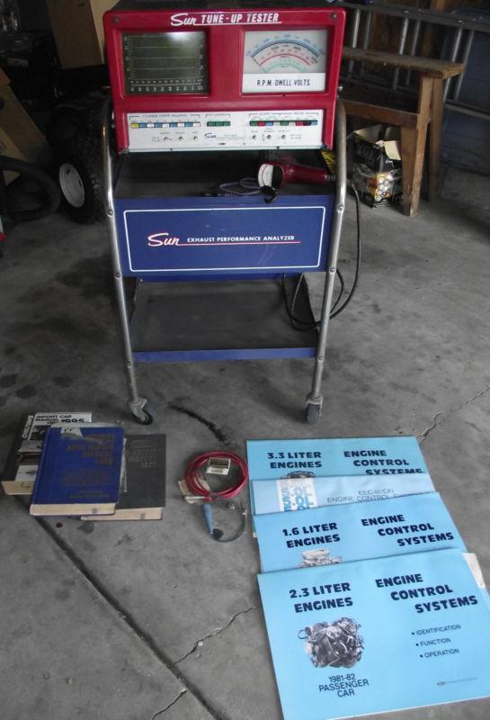 Sun tune up tester with scope,rolling cart,manuals,cords.