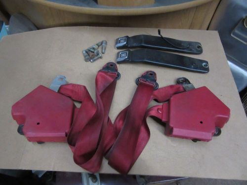 Corvette seat belts with mount bolts from a 92 red with black latch ends.