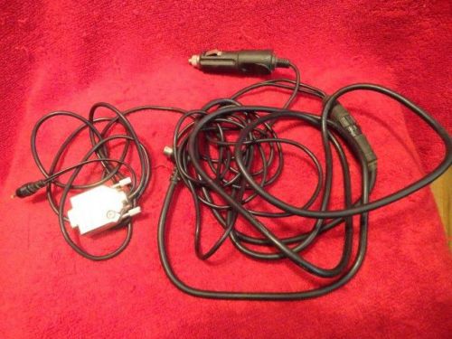 Gps power adapter plugs into power source and cigarette lighter adapter