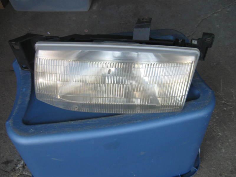 Ford escort  headlight driver left side lh  1991-1996 factory original