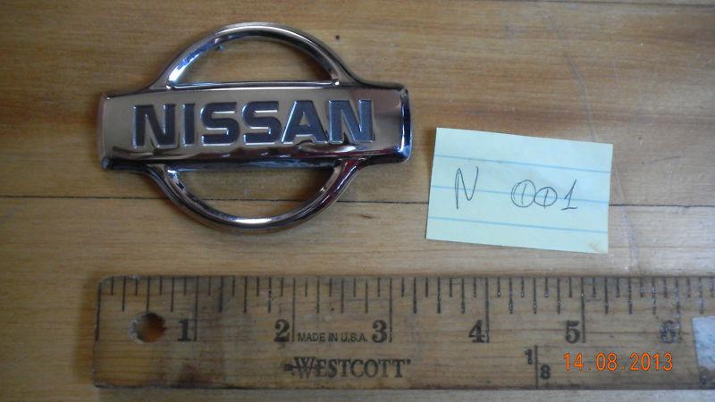 N 001 - nissan genuine trunk rear emblem badge ornament symbol