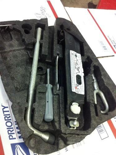 Mini cooper trunk tool/jack kit oem used. see pictures !!! tow hook lug wrench
