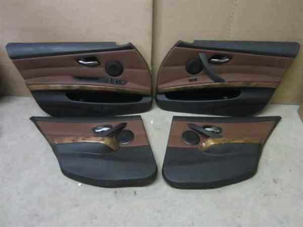 06-11 bmw 335 set of brown leather door trim panels oem