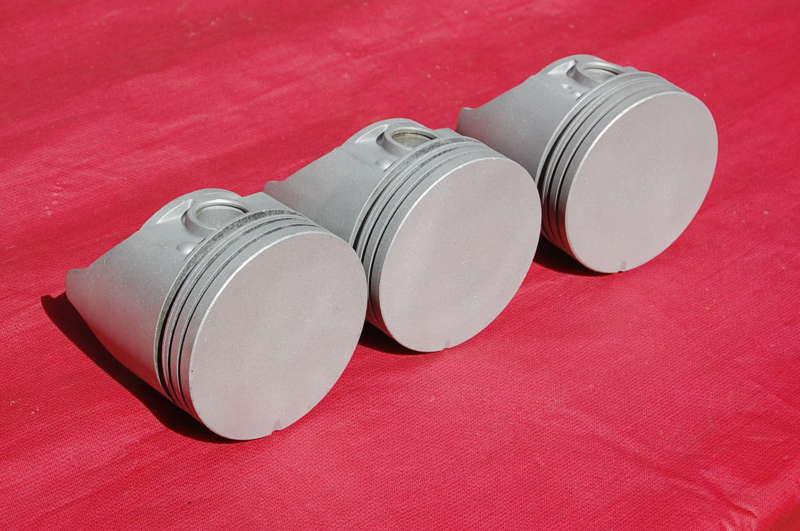 3- original 406 ford pistons