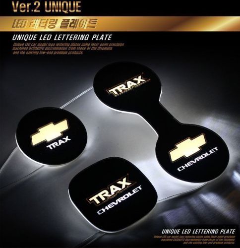 Led surface emission lettering cup holder plate for chevrolet trax 2013+