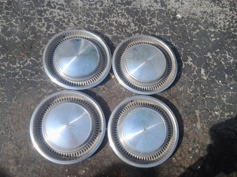 Buy Plymouth Voyager Hubcap P/N 63428K in Hammond, Indiana, US, for