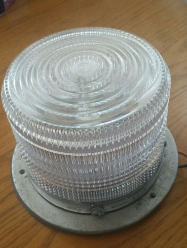 One low profile clear  permanent mount strobe light  specialty mfg