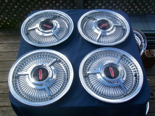 1963-64 14&#034; oldsmobile hubcaps set of 4