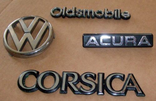 Plastic oldsmobile, corsica, acura and voltswagon  car emblems
