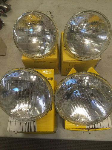 2 each westinghouse nos headlights. # 4000   # 4001.    4 total