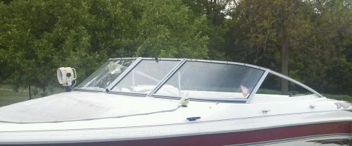 Curved glass windshield complete off a 1999 larson window windshield