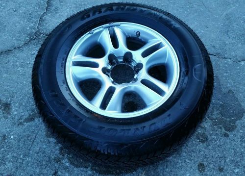 One used dunlop at20 grandtrek  265 65 17 no repairs, no wear.  gx470 wheel