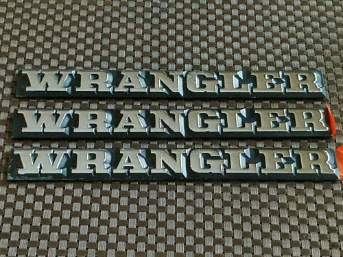 Nos jeep yj wrangler name plate large rear tub emblem