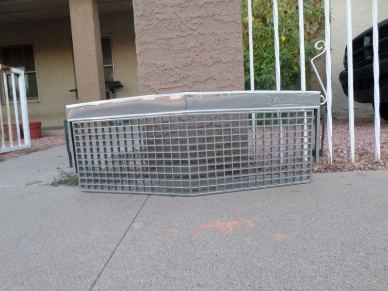  1986 87 88 cadillac fleetwood brougham grille & grille surround (2 pieces)oem
