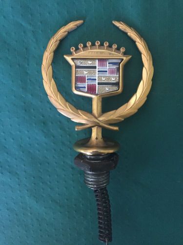 Gold cadillac hood emblem