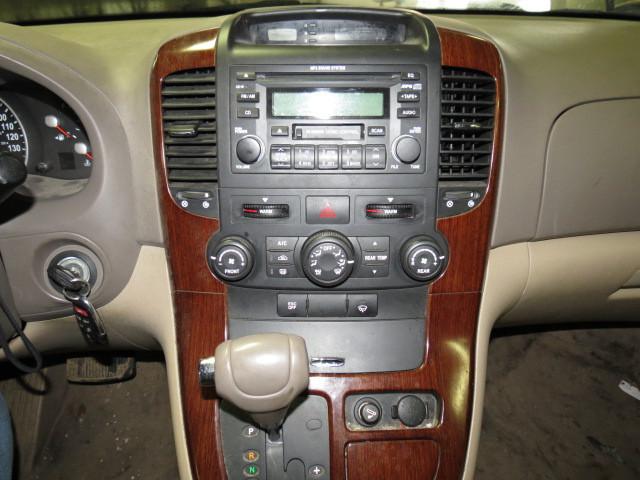 2006 kia sedona radio trim dash bezel 2570823