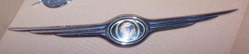 01 02 03 chrysler voyager front grille emblem oem # 4857334aa