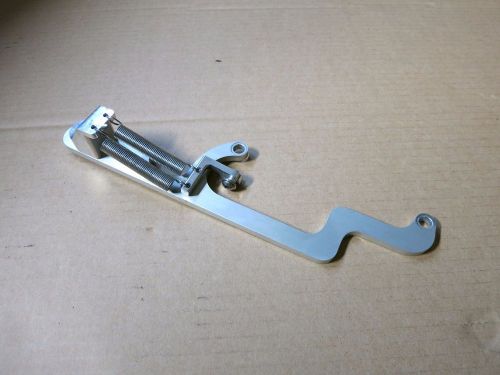 Dominator return spring bracket