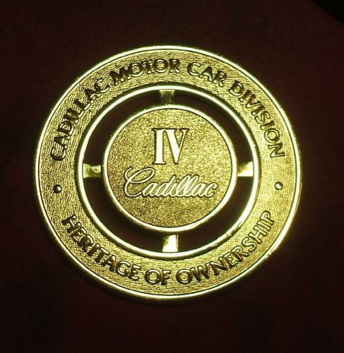Cadillac motor car division heritage of ownership iv front grille emblem badge