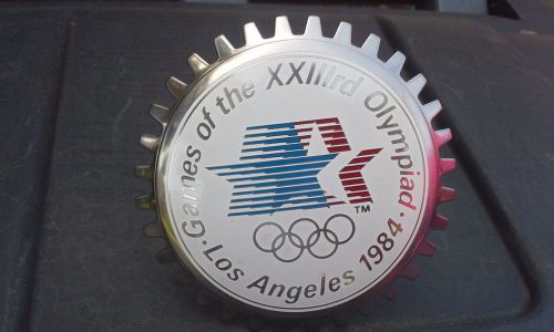 New old stock 1984 porcelain olympic grill badge....&lt;&lt;&lt; look