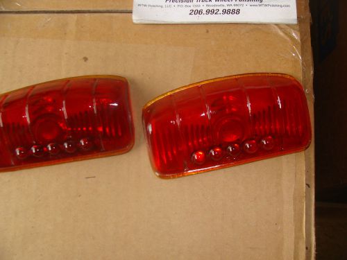 A pair of 1942 plymouth deluxe stop ight lenses