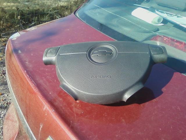 Chevy aveo 4 door sedan main front airbag for a black steering wheel