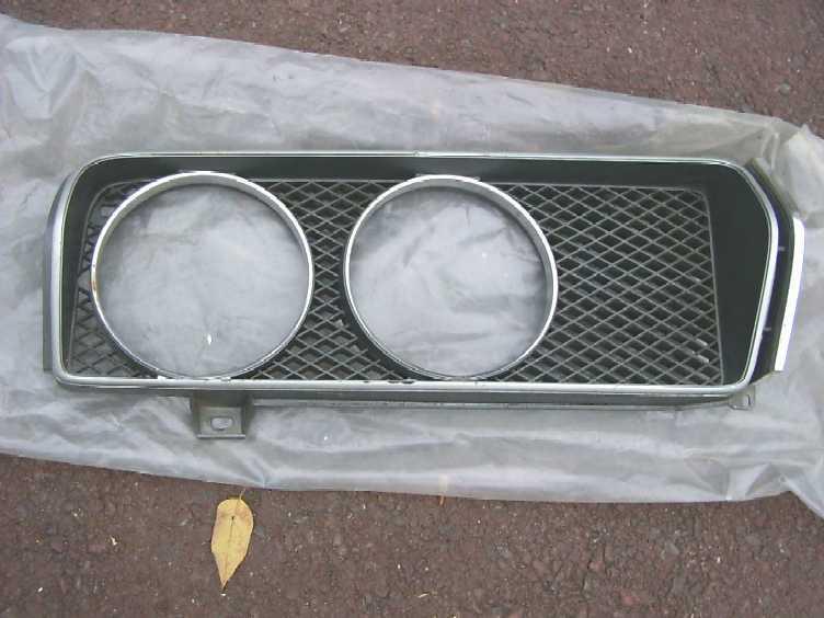 Old toyota headlight door grille half