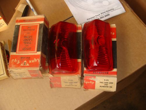 A pair of 1942 plymouth tail ight lenses