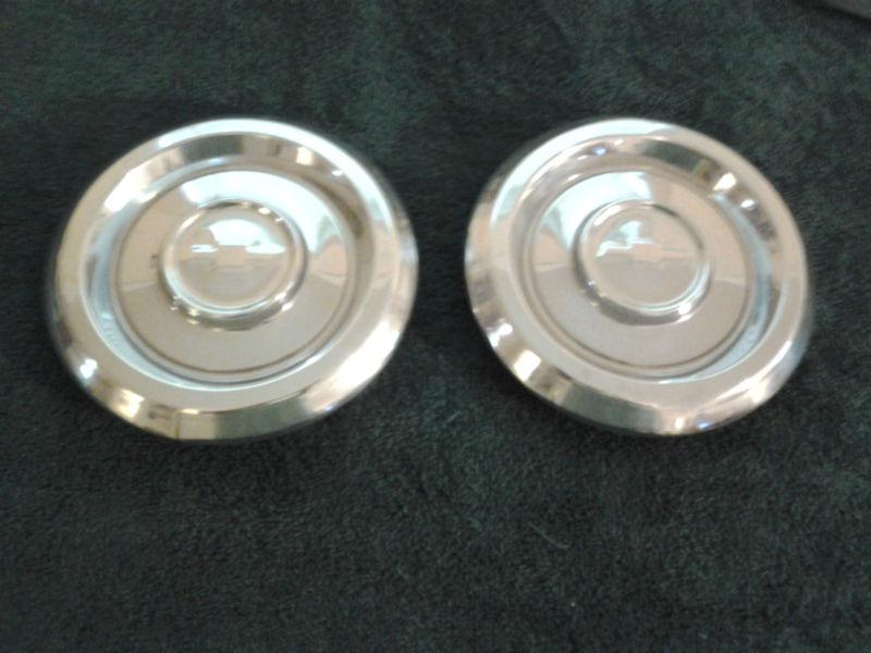 Pair of chevy hub caps
