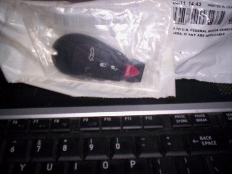 Chrysler keyless remote fobik p/n 68058346ac new oem 
