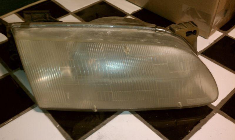 93 94 95 96 97 mazda mx-6 r. headlight 0014099r