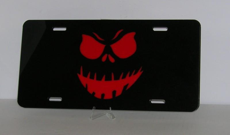 Scary face  inlaid  license plate  black and red