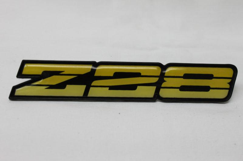 90-92 camaro z28 yellow dash emblem used oem