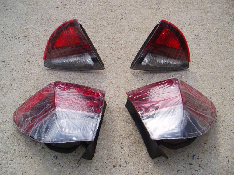 Bmw oem 2005 325xi e91 touring 4 piece tail light assembly brand new in box mint