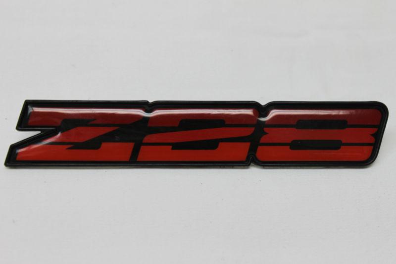 85-87 camaro z28 tri-color red dash emblem used oem