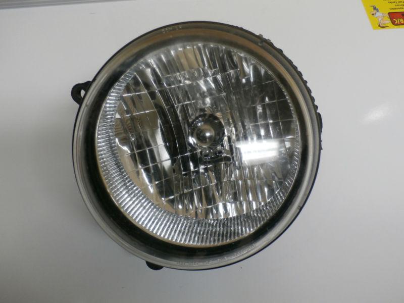 02-04 jeep liberty driver side head light