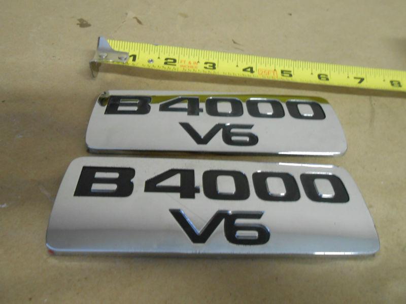 1998,98,99,00,01 mazda b4000 v6 (2) fender emblem oem free shipping