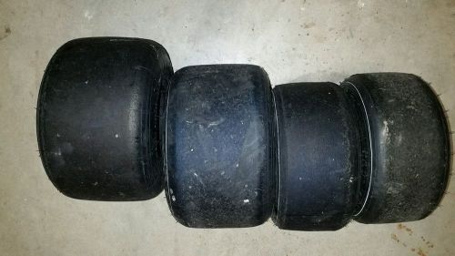 A set of used mojo whites go kart tires