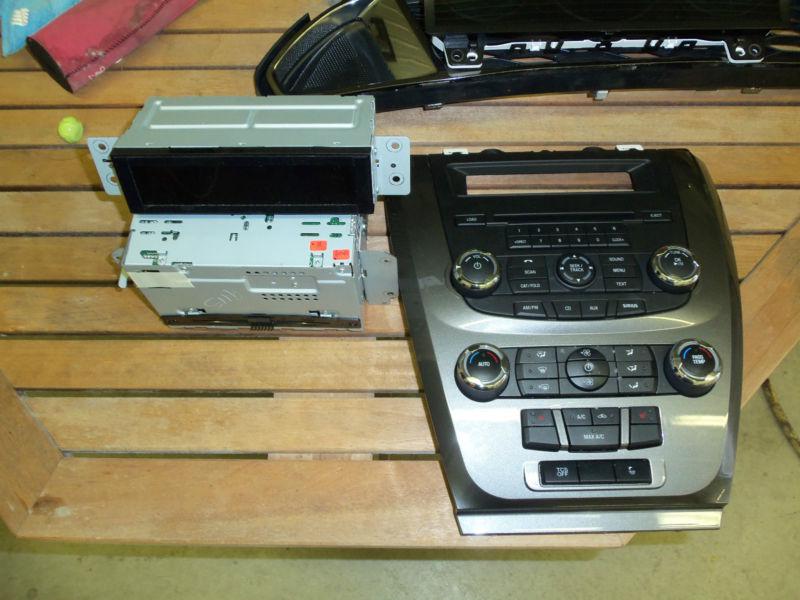Ford fusion radio heat and a/c control console with cd player and display