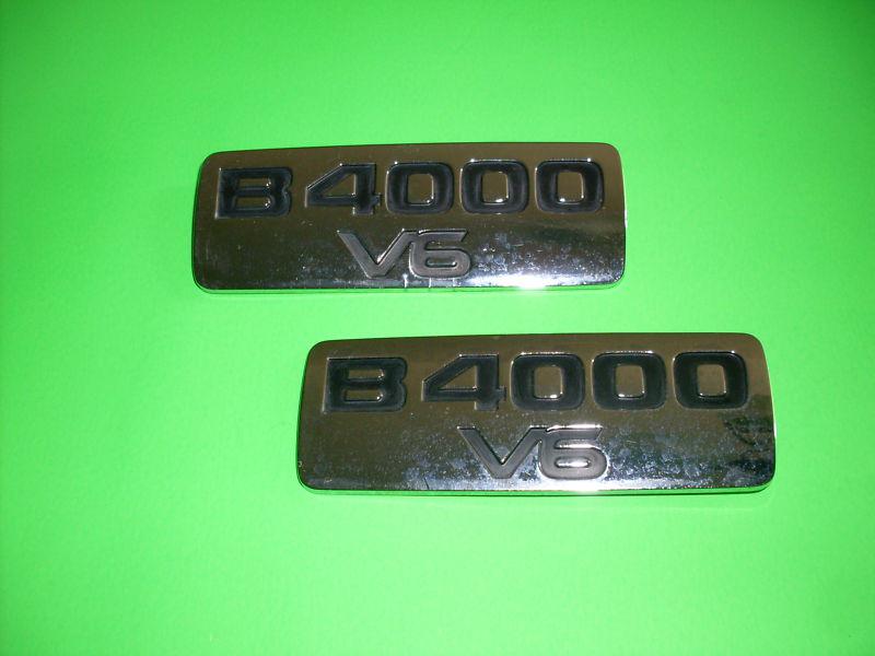 1996 thur 2000,s mazda truck b4000 v6 fender emblems/crome plastic/good cond.