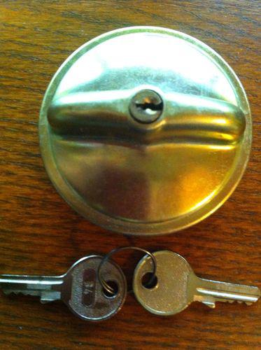 Brass tone locking gas cap.  assume for a german made car, two keys.  never used