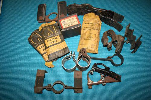 Vintage car parts - nos assortment of exhaust hangers and clamps.