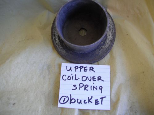 Upper spring bucket for coil over spring used with wedge bolt