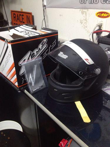 Racing helmet , flat black, size large