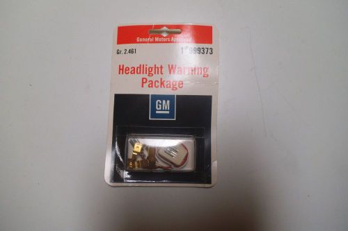 Gm headlight warning pkg.  part# 999373  rare discontinued accessory  nos