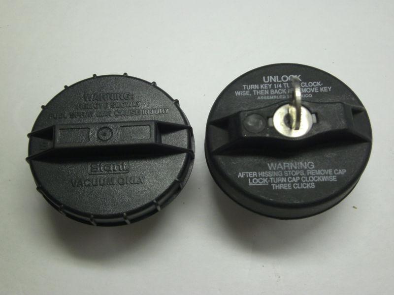 Sell 2 Vacuum Gas Caps 1 is a locking (JT019) w key (R) & the other is