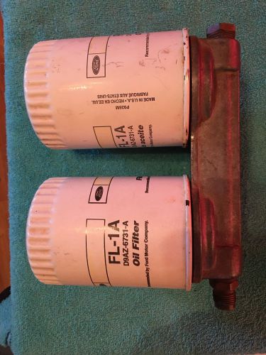 Dual oil filter roll cage mounted