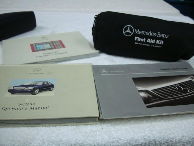 Mercedes benz black folder with owner's manual and first aid kit