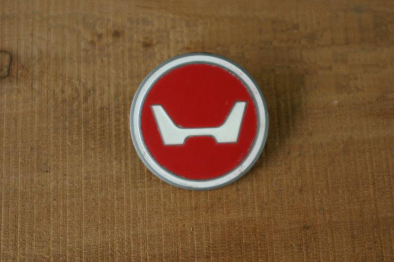 Very rare and nice....headlight bucket emblem with hardware for your 69/71 z50